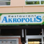 Foto zu Restaurant Akropolis: Eingangsbeschilderung