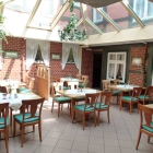 Foto zu Gundelfinger's Gasthaus - Hotel Alter Markt: Wintergarten