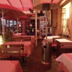 Foto zu Restaurant Katzen-Cafe: Überdachte Terrasse mit Heizstrahlern