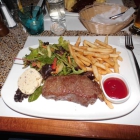 Foto zu Brasserie Atlas: Rumpsteak ( 260 Gr. ) mit Pommes Frites Kräuterbutter und Salat 	17,50 €